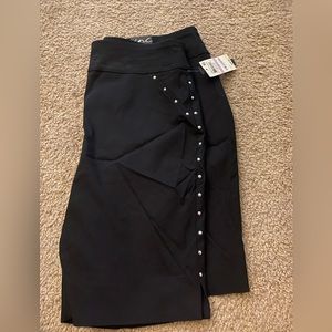 INC pull on black shorts with silver decals down sides and front. NWT size 6